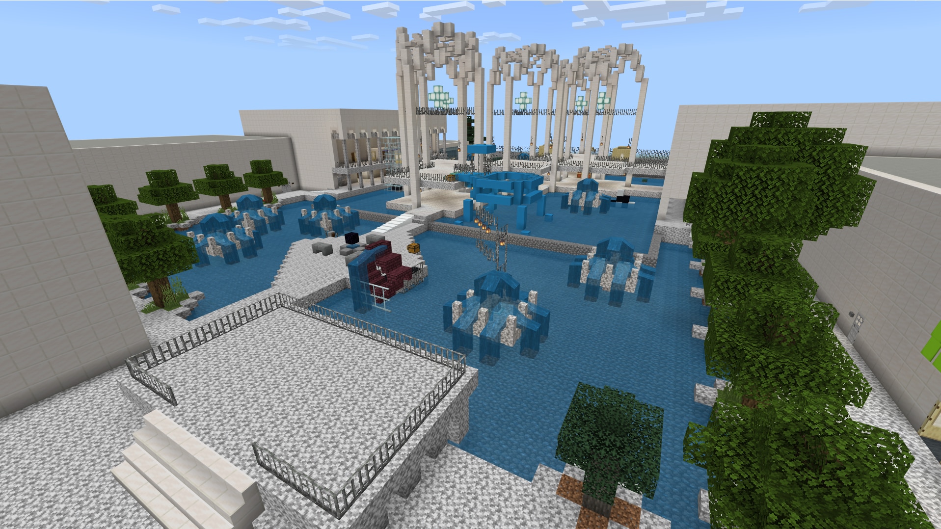 A campus with fountains and arches is constructed in Minecraft Education Edition