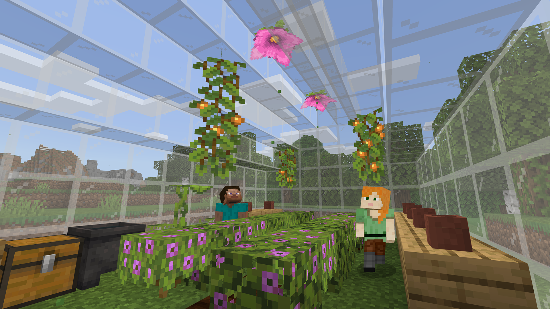 Alex and Steve in a glass greenhouse