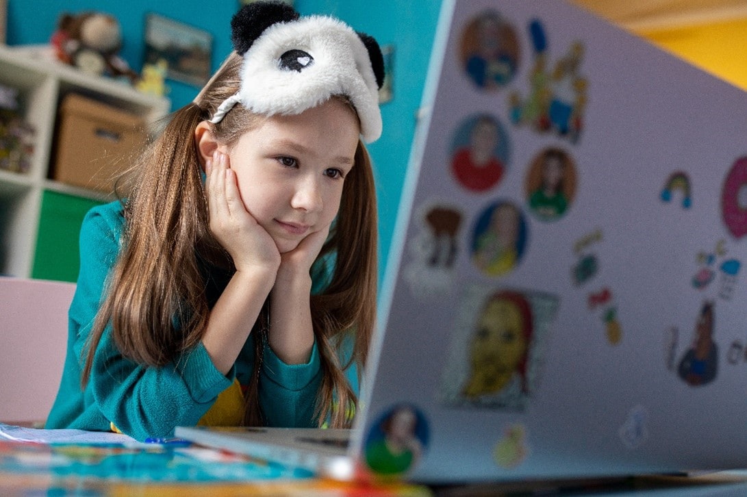 Student looking at a laptop computer