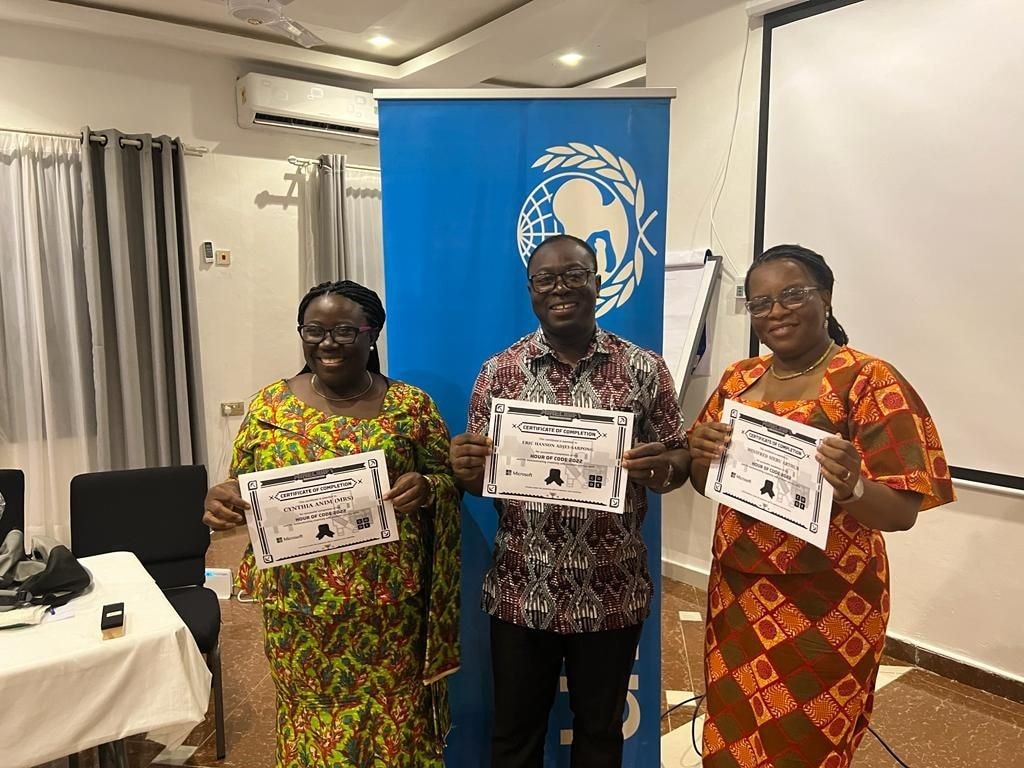 Three teachers holding certificates