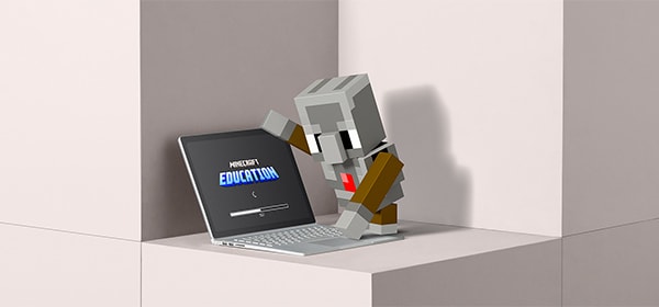 The agent taps a key on a laptop running Minecraft Education