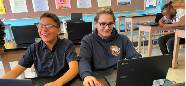 Students using laptops in the classroom