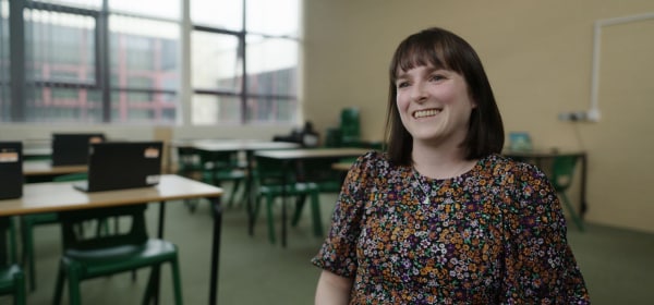 A teacher sitting in a classroom